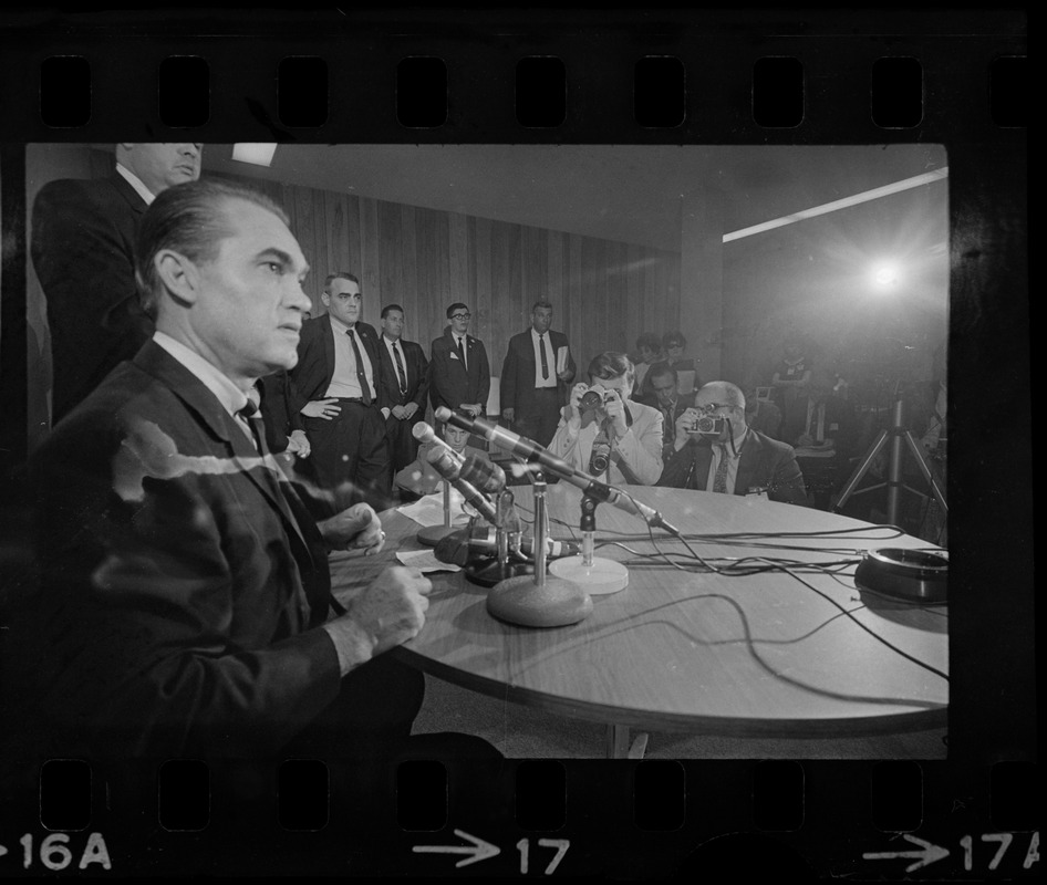 Former Alabama Gov. George Wallace addresses newsmen at Logan Airport during unexpected visit to Hub