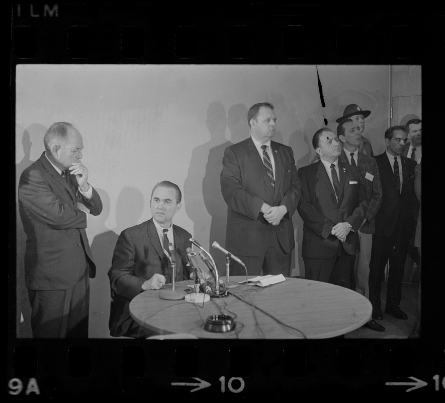 Former Alabama Gov. George Wallace addresses newsmen at Logan Airport during unexpected visit to Hub