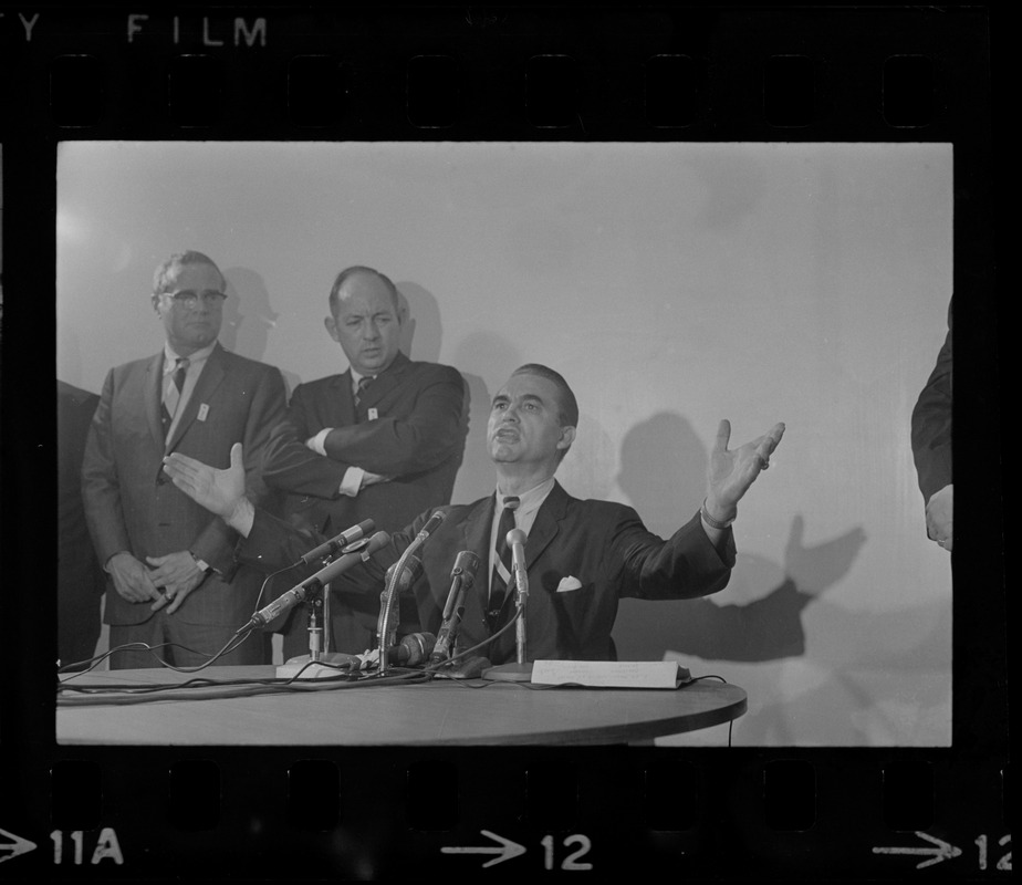 Former Alabama Gov. George Wallace addresses newsmen at Logan Airport during unexpected visit to Hub