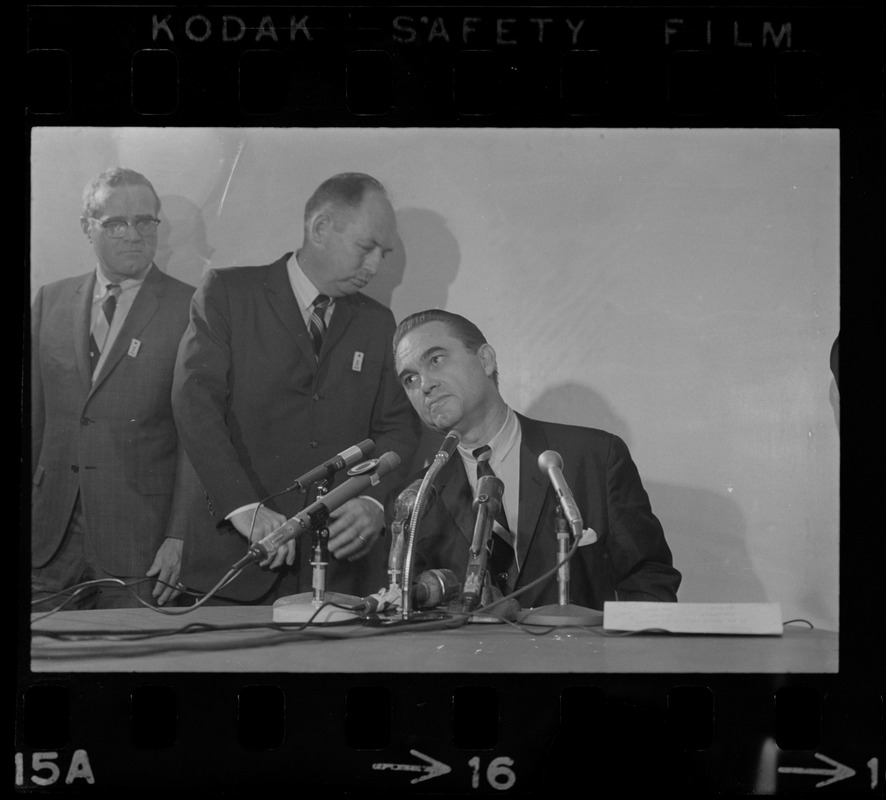 Former Alabama Gov. George Wallace addresses newsmen at Logan Airport during unexpected visit to Hub