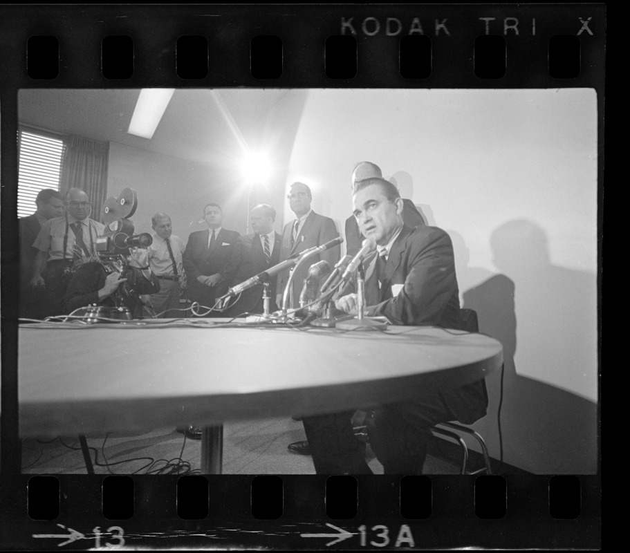 Former Alabama Gov. George Wallace addresses newsmen at Logan Airport during unexpected visit to Hub