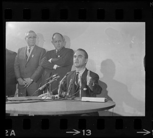 Former Alabama Gov. George Wallace addresses newsmen at Logan Airport during unexpected visit to Hub