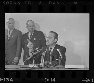 Former Alabama Gov. George Wallace addresses newsmen at Logan Airport during unexpected visit to Hub