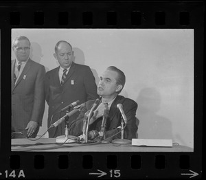 Former Alabama Gov. George Wallace addresses newsmen at Logan Airport during unexpected visit to Hub