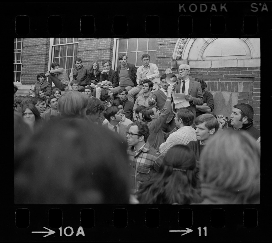 Boston State College Pres. John O'Neill uses bullhorn to answer questions from noisy students