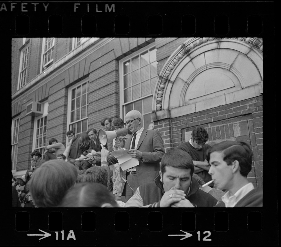 Boston State College Pres. John O'Neill uses bullhorn to answer questions from noisy students