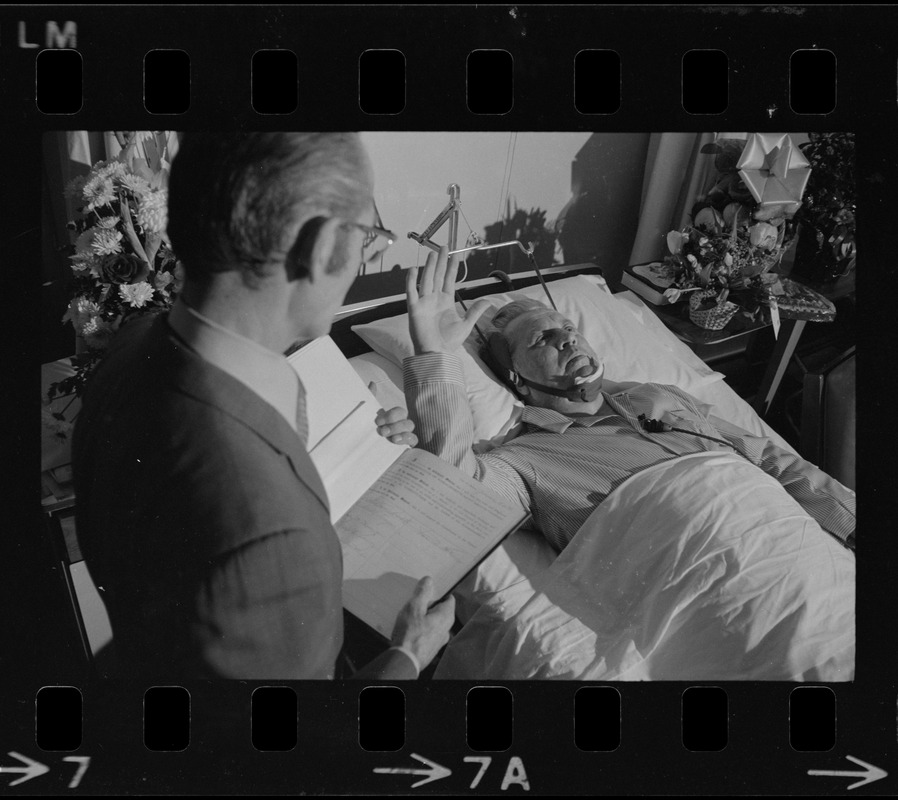 Albert L. (Call me Dapper) O'Neil takes the oath in his hospital bed as the ninth member of Boston's City Council from Asst. City Clerk Fredrick O'Donnell