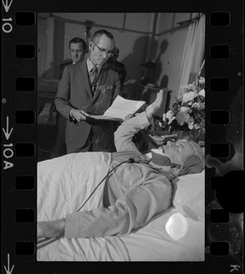 Albert L. (Call me Dapper) O'Neil takes the oath in his hospital bed as the ninth member of Boston's City Council from Asst. City Clerk Fredrick O'Donnell