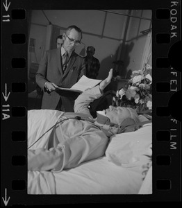 Albert L. (Call me Dapper) O'Neil takes the oath in his hospital bed as the ninth member of Boston's City Council from Asst. City Clerk Fredrick O'Donnell