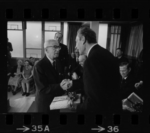Italian Foreign Minister Aldo Moro receives gift from Salvadore Barrile at Don Orione Home in East Boston
