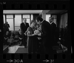 Italian Prime Minister Emilio Colombo receiving gift from Rosa Mancini at Don Orione Home in East Boston