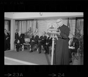 Priest speaking during Italian Prime Minister Emilio Colombo's visit to Don Orione Home in East Boston