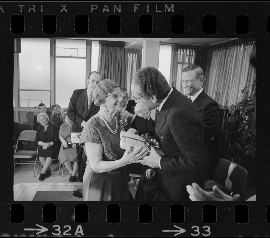 Italian Prime Minister Emilio Colombo receiving gift from Rosa Mancini at Don Orione Home in East Boston