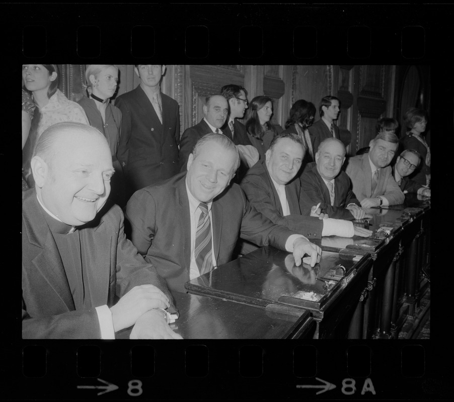 Msgr. Mimie B. Pitaro, left, and other members of the Massachusetts House of Representatives