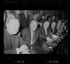 Msgr. Mimie B. Pitaro, left, and other members of the Massachusetts House of Representatives