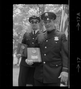 Boston Police Capt. Charles Barry, left, and officer John Corbett during Flag Day exercises at Parkman Bandstand