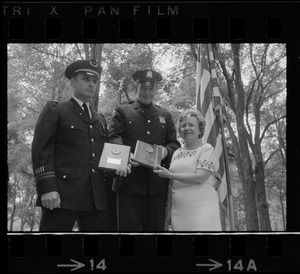Boston Police Capt. Charles Barry, left, officer John Corbett, and unidentified woman during Flag Day exercises at Parkman Bandstand