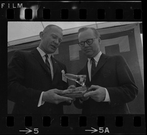 Astronaut Buzz Aldrin, left, presents MIT President Howard Johnson with model of the Gemini 12 spacecraft in which he orbited the earth
