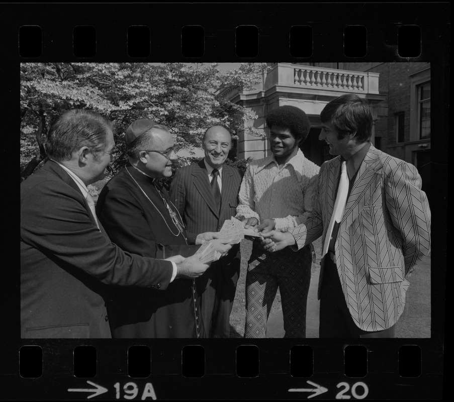 A block of tickets for the Schaefer Sound of Summer Concert with Arthur Fiedler and members of the Boston Pops Orchestra is presented to an appreciative Archbishop Medeiros. On hand for the presentation were, from left, sportscaster Ken Coleman, the Archbishop, Bill Koster, executive director of the Jimmy Fund, and the Red Sox stars Carl Yastrzemski and Reggie Smith