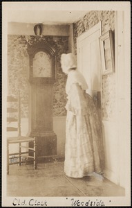Woodside, 18 Brewster Road, interior view, clock and unidentifed costumed person