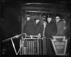 Gov. Curley shown on Roosevelt's special train in Boston with Mayor Fred W. Mansfield and Commissioner Eugene M. McSweeney
