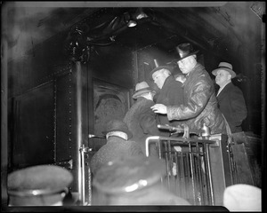 Gov. Curley shown with Mayor Fred W. Mansfield and Commissioner Eugene M. McSweeney on Roosevelt's special train
