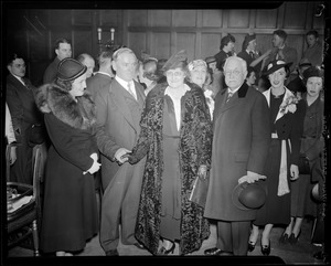 Curley shown with wife and daughter at tea party