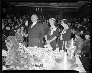 Curley shown with wife and daughter at tea party