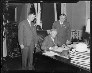 Gov. Curley, F.L. Wallace, Sen. Joseph Mulhern signing Morris Plan Bill