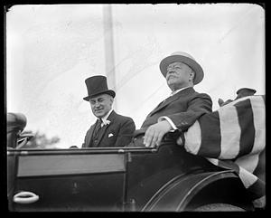 Howard Taft sitting with an unidentified man in an automobile