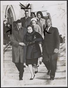 Mr. and Mrs. E. Saunders leave St. Hugh's Church