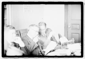 Group of men at table