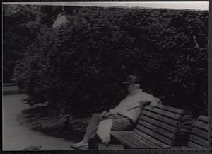 Older man sitting on a park bench