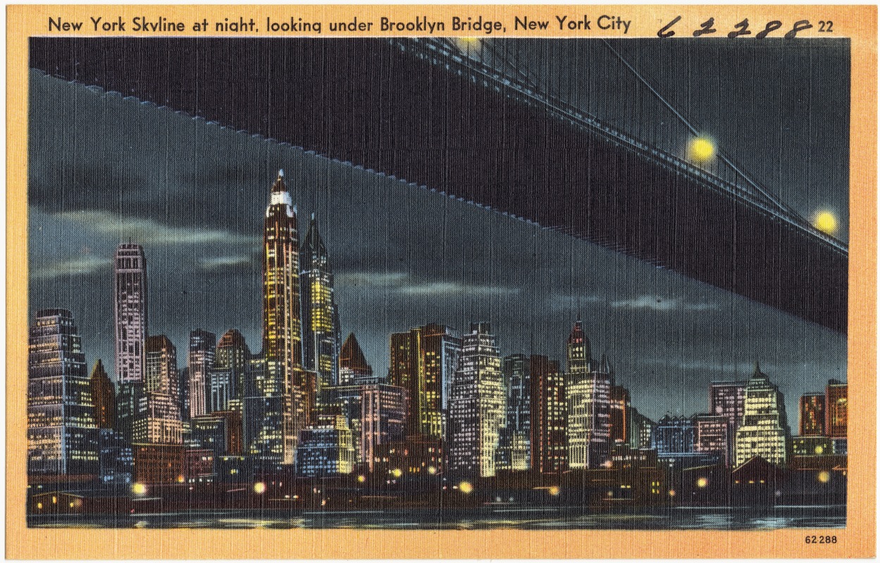 New York skyline at night, looking under Brooklyn Bridge, New York City