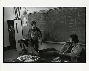 Two students and teacher in classroom