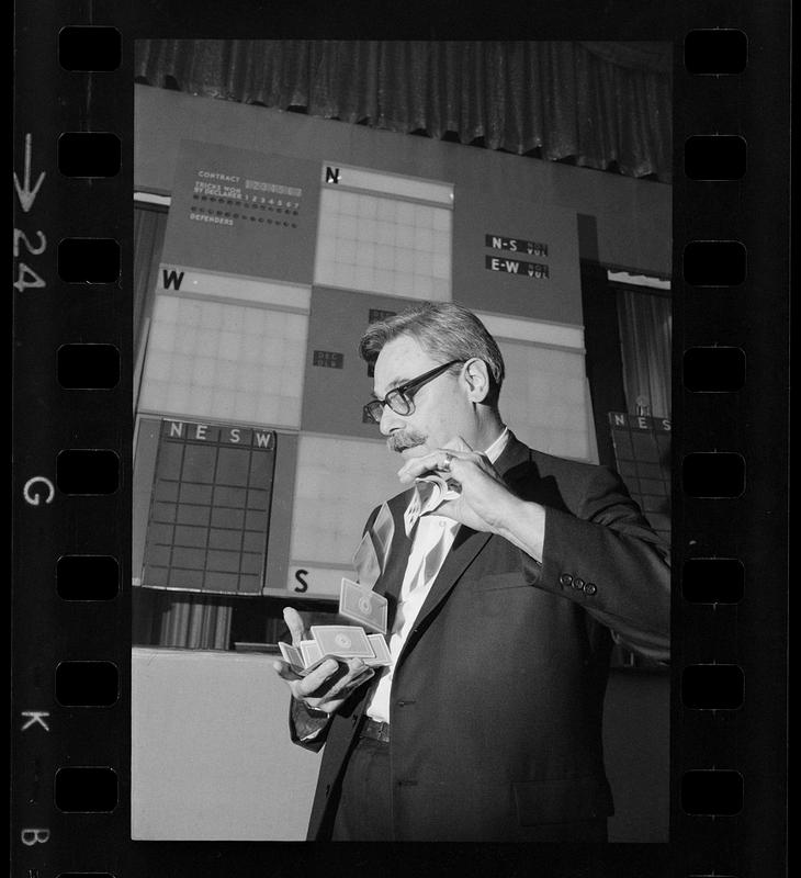 Shuffling the cards at a bridge players convention, Hynes Auditorium