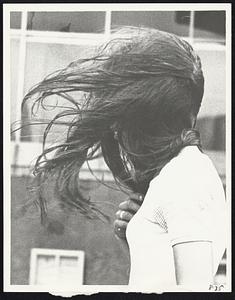 Backing into wind, girl makes her way through Prudential Center during tropical storm Doria’s visit yesterday.