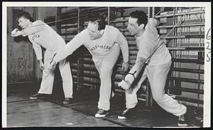 Tigers Getting Into Shape for start of training season are shown working out in a Detroit gymnasium. Left to right: Pitchers Ted Gray and Virgil Trucks and Catcher Joe Ginsberg.