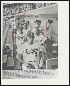 No Joy in the Dodger Dugout--A glum looking group of Los Angeles Dodgers leave the dugout in Los Angeles today after losing 4 to 0 to the Pittsburgh Pirates and failing to clinch the National League pennant. Leading the parade is rookie Dick Nen (5), followed by Dick Tracewski (44), Wally Moon (9), Roy Gleason (36), and Willie Davis, center background without a cap.