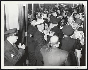 No More Room-Police hold back persons seeking admittance to School Committee meeting already taxed to its 112 person legal limit. As one spectator would leave, another would be granted admittance to room.