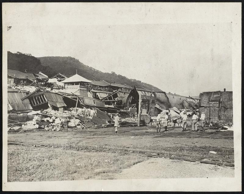 [illegible] Japanese Earthquake Pictures! This great photo of the Japanese earthquake which took toll of [illegible] 350,000 lives shows - a collapsed factory at the Fuji Cotton Spinning Works at Koyama, near Hakone, Japan, in which 500 girl employees were killed.