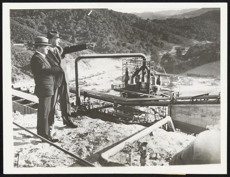 Magnesium Plant in California Will Double U. S. Supply. Sidney Hillman (left), co-director of the Office of Production Management, is shown during a visit to the great, new Permanente magnesium plant here, which is expected by next March to be turning out 12,000 tons of magnesium a year, twice as much as was produced in this country last year, when a magnesium shortage appeared as a dangerous bottleneck in America's defence industries. With Mr. Hillman is Dr. Fritz Hangiro who invented the progress by which the magnesium will be manufactured. Dr. Hangiro's process uses ore brought from Nevada, petroleum coke from Los Angeles, natural gas piped in from Southern California oil fields and electric power from the high Sierra. Magnesium, king of the metals of war, is used in the manufacture of deadly incendiary bombs, for the casing of high-explosive missiles and in the construction of today's lightest, fastest and most powerful military airplanes. The Permanente plant, built in seven months with a loan of $9,250,000 approved by the Reconstruction Finance Corporation, started full production Oct. 8.