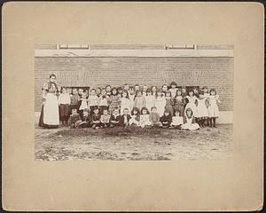 Pupils and teacher in front of Groton Street School