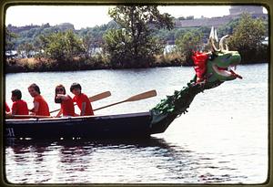 Boston - Charles River Esplanade: A dragon boat crew rows during the annual Dragon Dragon Boat Fest - 1981