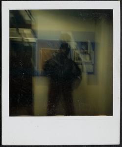 Man standing in front of bulletin board