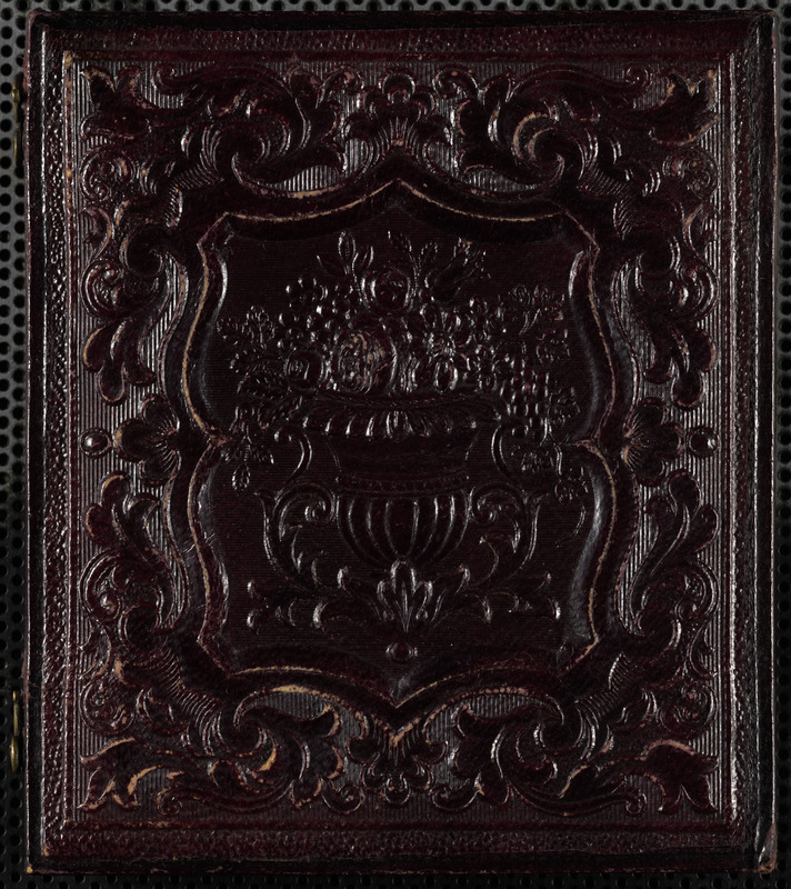 Portrait of man with book on lap