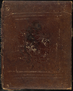 Portrait of woman holding book in lap