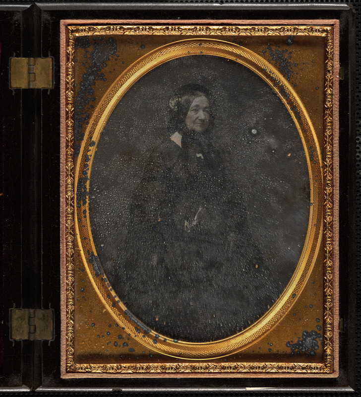 Portrait of woman in dark bonnet