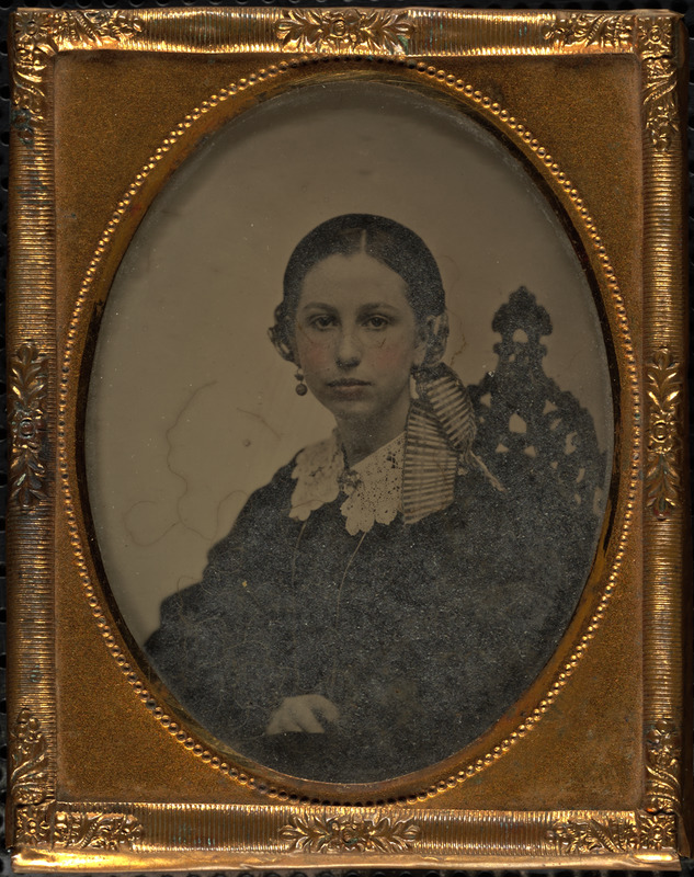 Portrait of woman with striped hair ribbon