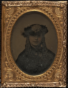 Portrait of woman in hat with embellishment